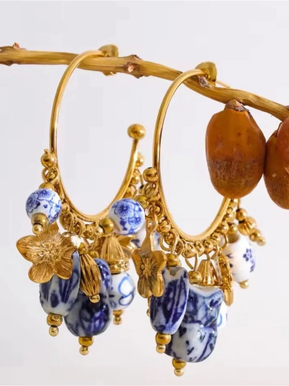 Gold Hoop Earrings with Blue and White Beads and Floral Charms